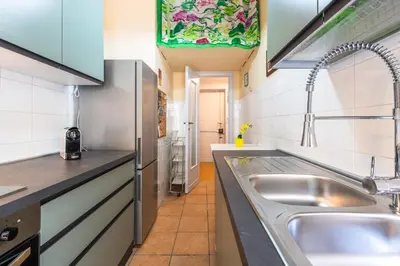 a kitchen with a sink and a counter top at Magiù Apartment in Rome