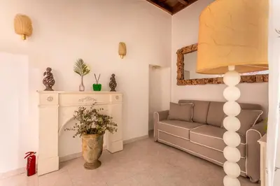 a living room with a couch and a fireplace at iFlat Comfy apt a few steps from the Vatican in Rome