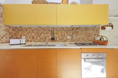 a kitchen with a sink and a stove at At the Vatican Ottaviano 2 bedrooms 2 baths in Rome