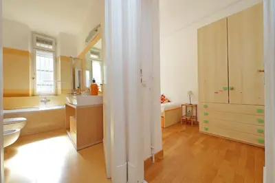 a bathroom with a sink and a toilet in a room at At the Vatican Ottaviano 2 bedrooms 2 baths in Rome
