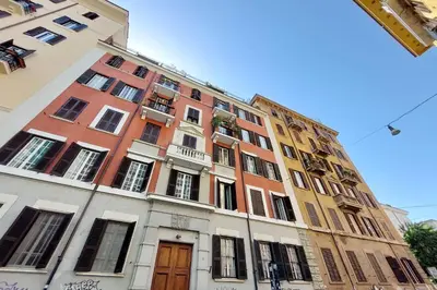 a tall building with many windows on a street at At the Vatican Ottaviano 2 bedrooms 2 baths in Rome