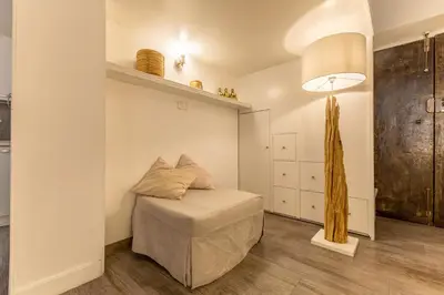 a small room with a bed and a lamp at Piazza Navona Elite Flat in Rome