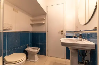 a bathroom with a toilet and a sink at Piazza Navona Elite Flat in Rome