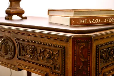 a wooden table with books on top of it at Casa Acerbo - Rome Navona Apartment in Rome