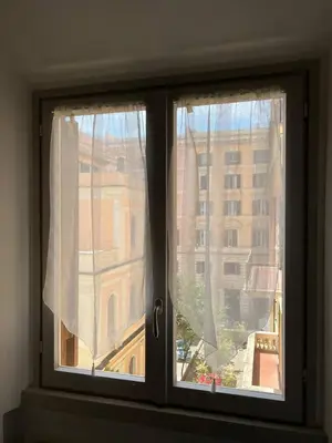 a window with a view of a building at Casa dolce Roma Prati in Rome