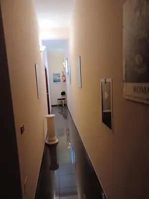 a hallway of a hospital with a long counter at PITAGORA Rooms in Rome