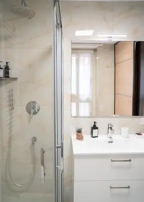 a bathroom with a shower and a sink and a mirror at Candelor House - Apartment & Garden Trastevere in Rome