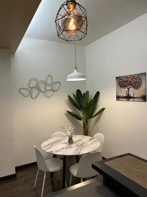 a dining room with a table and chairs at Candelor House - Apartment & Garden Trastevere in Rome