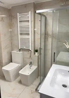 a bathroom with a toilet and a sink and a shower at Candelor House - Apartment & Garden Trastevere in Rome