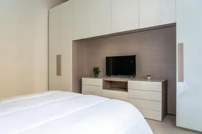 a bedroom with a bed and a flat screen tv at alPigneto Apartment Rome in Rome
