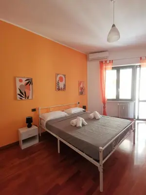 a bedroom with a bed with two towels on it at Cipro Home in Rome