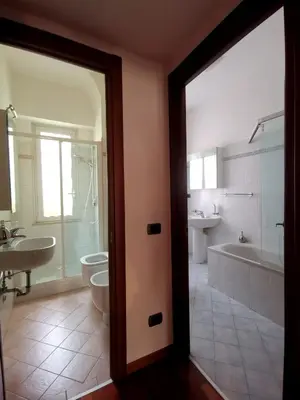 a bathroom with a tub and a toilet and a sink at Cipro Home in Rome