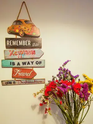 a sign that says remember that happiness is a way of travel at Cipro Home in Rome