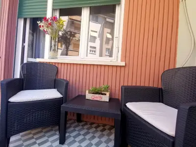 two chairs and a table on a porch with a window at Cipro Home in Rome