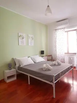 a bedroom with a large bed in a room at Cipro Home in Rome