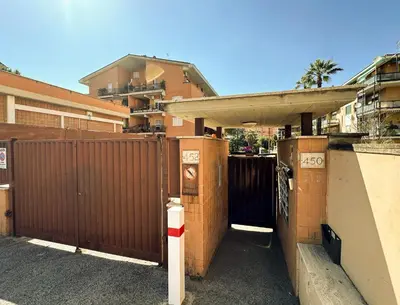 an entrance to a gate with a fence at Luminous 2BR Family Apartment in Residential Area in Rome