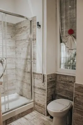 a bathroom with a toilet and a shower at B&B Exa Rooms - Just Rome in Rome