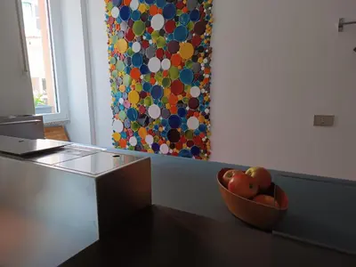 a bowl of apples on a table in a kitchen at Design House Monti in Rome
