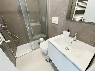 a bathroom with a toilet and a sink and a shower at Casa Vittoria in Rome