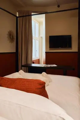 a hotel room with two beds and a window at Maison Luxury Pantheon in Rome