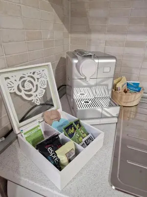 a small kitchen with a refrigerator and a microwave at GarbantSuite Apartment In Rome in Rome