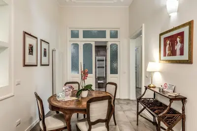 a dining room with a table and chairs at Nest House Prati in Rome