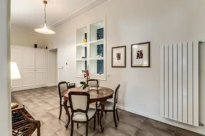 a dining room with a table and chairs at Nest House Prati in Rome