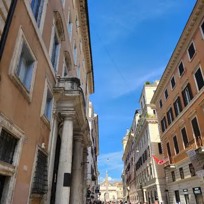 a building on a street in a city at Rooms house corso 22 in Rome
