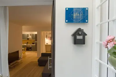 a door to a living room with a sign on it at Filo Guesthouse in Rome