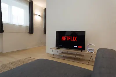 a living room with a flat screen tv on a table at Filo Guesthouse in Rome