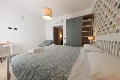 a bedroom with a large bed in a room at Giulia's Vatican Apartment Saint Peter in Rome
