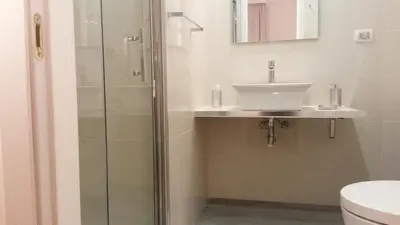 a bathroom with a sink and a shower at LCH-Lateran Charming House in Rome