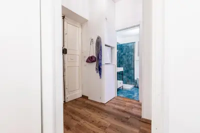 a hallway with white walls and wooden floors at Casa Crispi by Hili in Rome