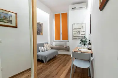 a small room with a desk and a couch at Casa Crispi by Hili in Rome