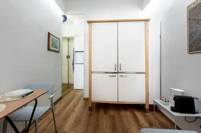 a room with a white closet and a table and chairs at Casa Crispi by Hili in Rome