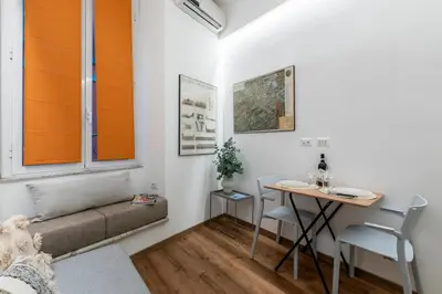 a living room with a couch and a table at Casa Crispi by Hili in Rome