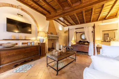 a dining room with a wooden table and chairs at Navona Historic Lovely Flat in Rome