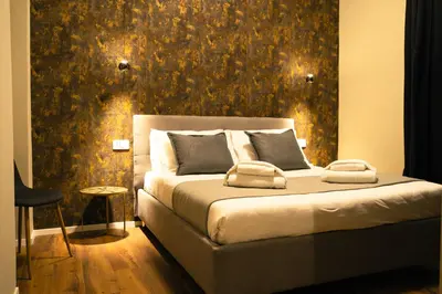 a bedroom with a bed with a wall mural at Casa Del Grande in Trastevere in Rome