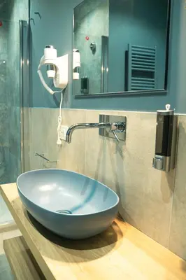 a bathroom with a large bowl sink on a counter at Casa Del Grande in Trastevere in Rome