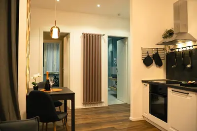 a kitchen with a table and a dining room at Casa Del Grande in Trastevere in Rome