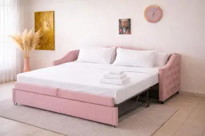 a bed with a pink bed frame in a room at Colosseum window 1800-Romantic apartment Rome in Rome