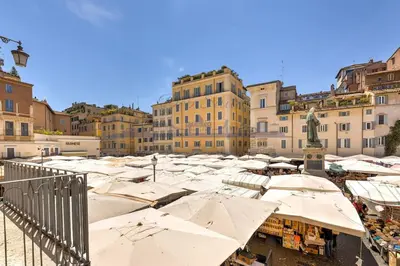 a group of umbrellas in a city with buildings at DEB Suite Campo de' fiori nel cuore di Roma in Rome