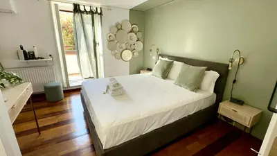 a bedroom with a large bed in a room at Casa Happya - Metro A - Central Rome in Rome