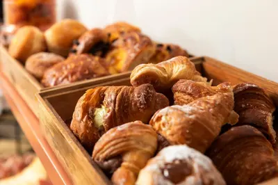 a group of baskets of bread and sandwiches on a table at Barberini Retreat Boutique Hotel in Rome