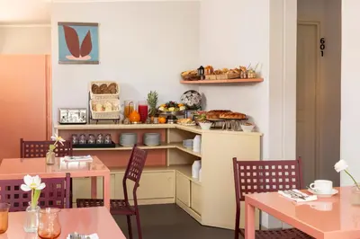 a group of bowls of bread and vegetables on a table at Barberini Retreat Boutique Hotel in Rome