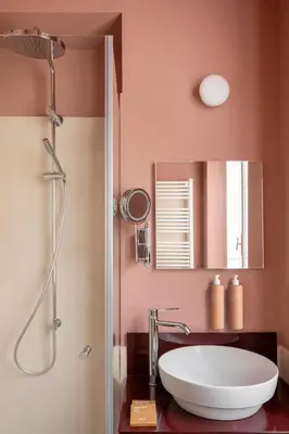 a dressing room with a coat hanging on the wall at Barberini Retreat Boutique Hotel in Rome