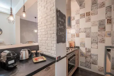 a kitchen with a counter with a stove top oven at BBB House Saint Peter in Rome