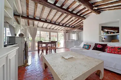a living room with a couch and a table at Magical Navona Duplex With Terrace by Halldis in Rome
