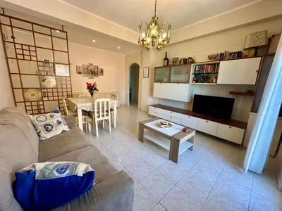 a living room with a couch and a table at Capa's Boccea in Rome