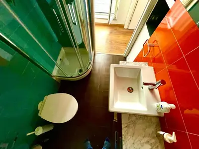 a bathroom with a sink and a toilet at Stanza in appartamento adiacente metro C in Rome